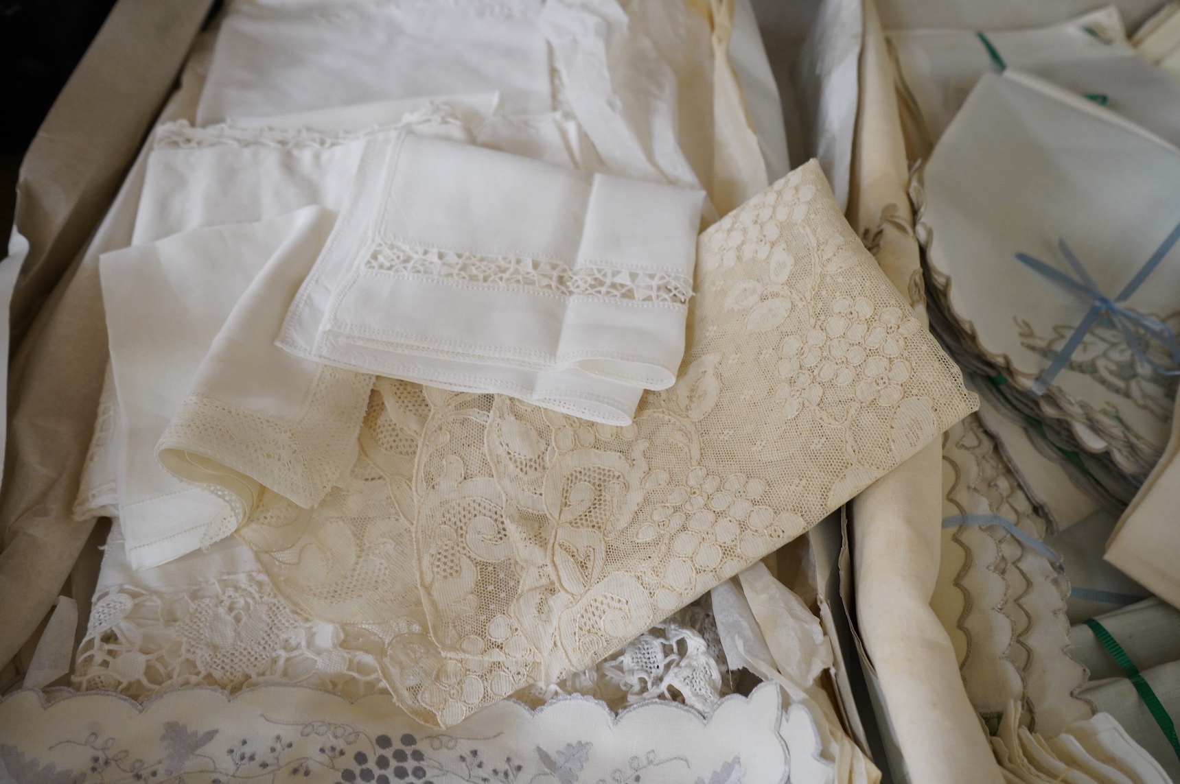 A collection of mixed damask embroidered and cutworked table cloths, napkin sets, hand towels and mats (in 3 boxes)